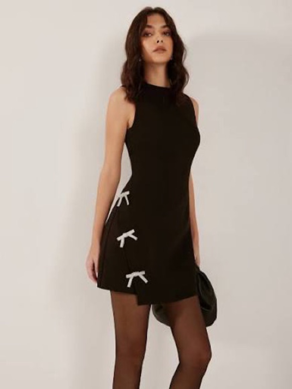 Commense Black Sleeveless Mini Dress with Silver Bow Accents